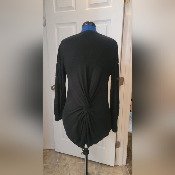 Black sweater with twisted back and lace sleeve detail. - Picture 2 of 7